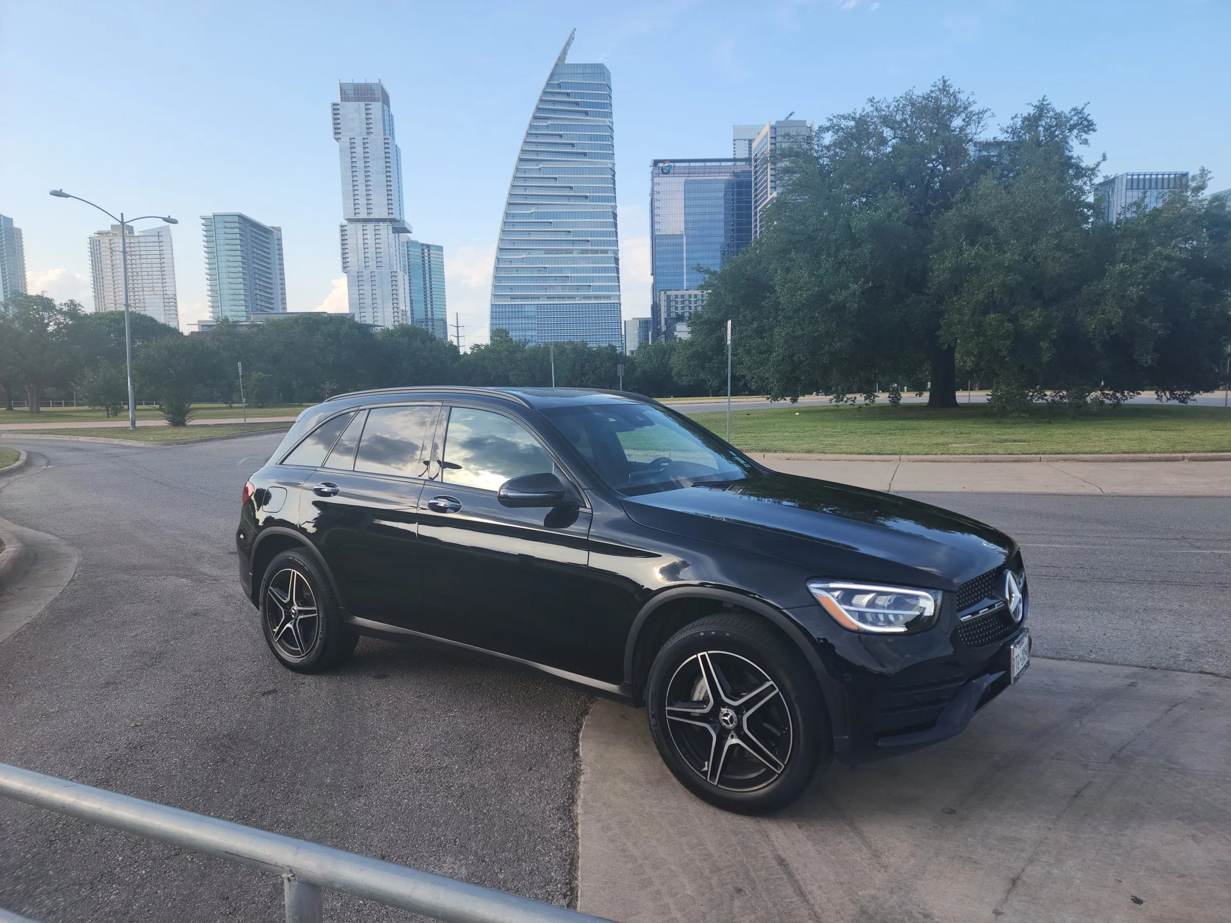 Lake Travis Limo black Mercedes-Benz, 4 passengers, with the downtown Austin skyline