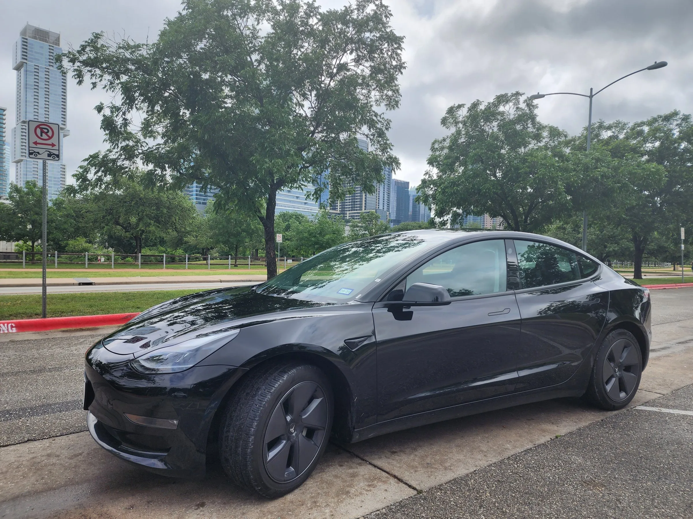 Lake Travis Limo black Tesla Model 3 in downtown Austin