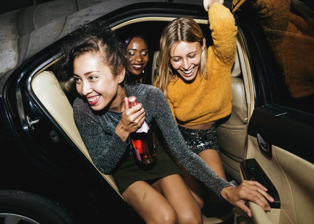 Diverse Women in a backseat of Lake Travis Limo Car